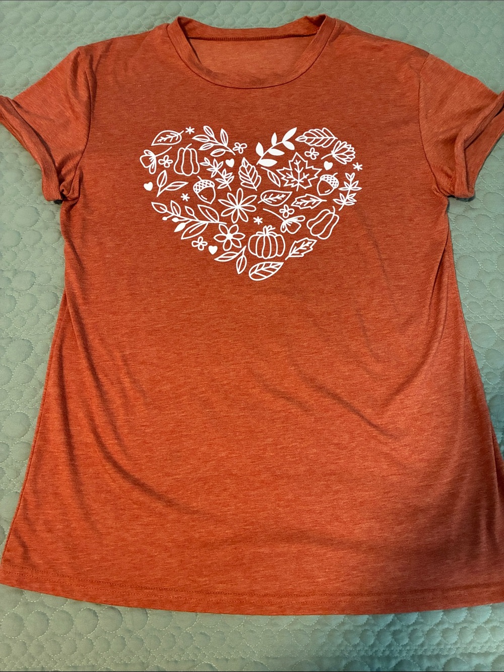 Amazon Women's Orange Short Sleeve Graphic Tee with White Heart Floral Design